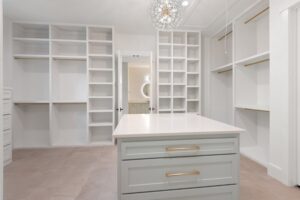 Custom Closet Design Featuring Ample Shelving and Modern Lighting