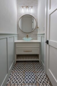 Powder Bath with Vessel Sink & Patterned Tile Flooring