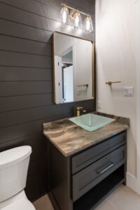 Stylish Powder Bath with Shiplap Accent Wall