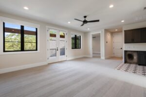 Upstairs Bonus Room with Balcony Access and Abundant Natural Light